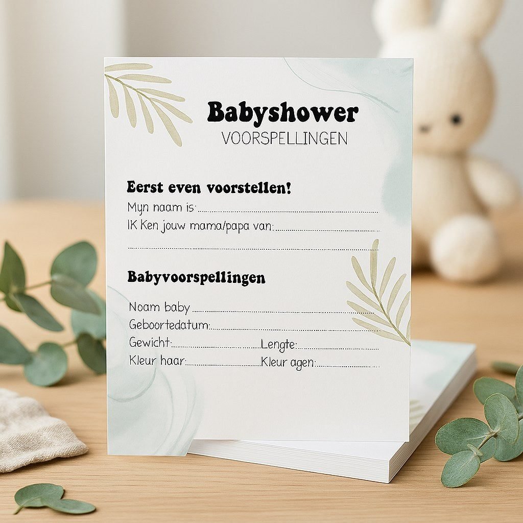 Babyshower invulkaarten en een quizkaart op tafel tussen eucalyptus